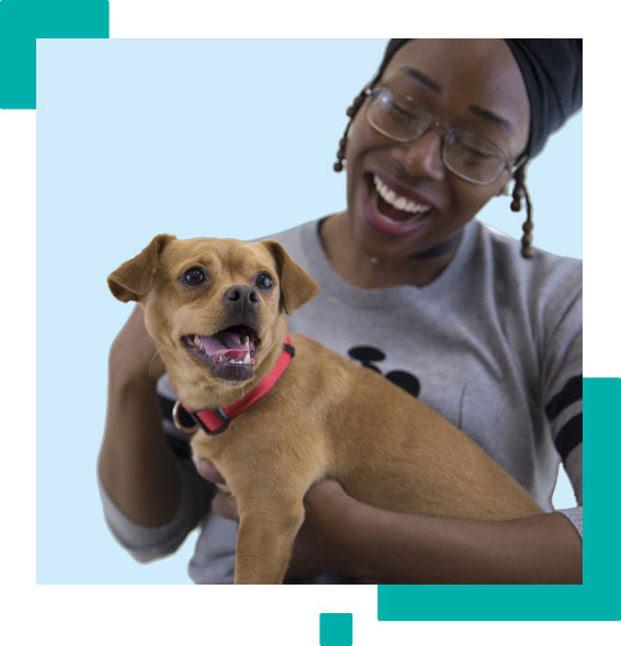 Domestic Violence Survivor Holds a Dog with a Blue Background
