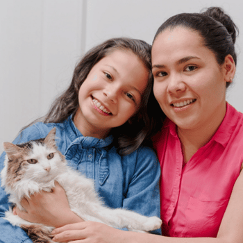 Cat and girl and woman smiling at the camera for PALs!